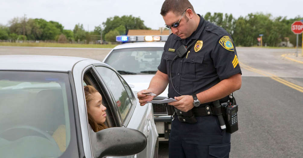 A police officer pulling over a car